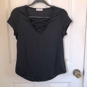 Cute short-sleeve black tee with criss-cross chest detail. Size XL